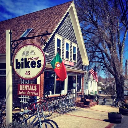 Ptown Bikes storefront with bikes and flags